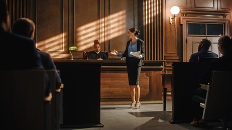 A woman conducting litigation appraisal inside the courtroom