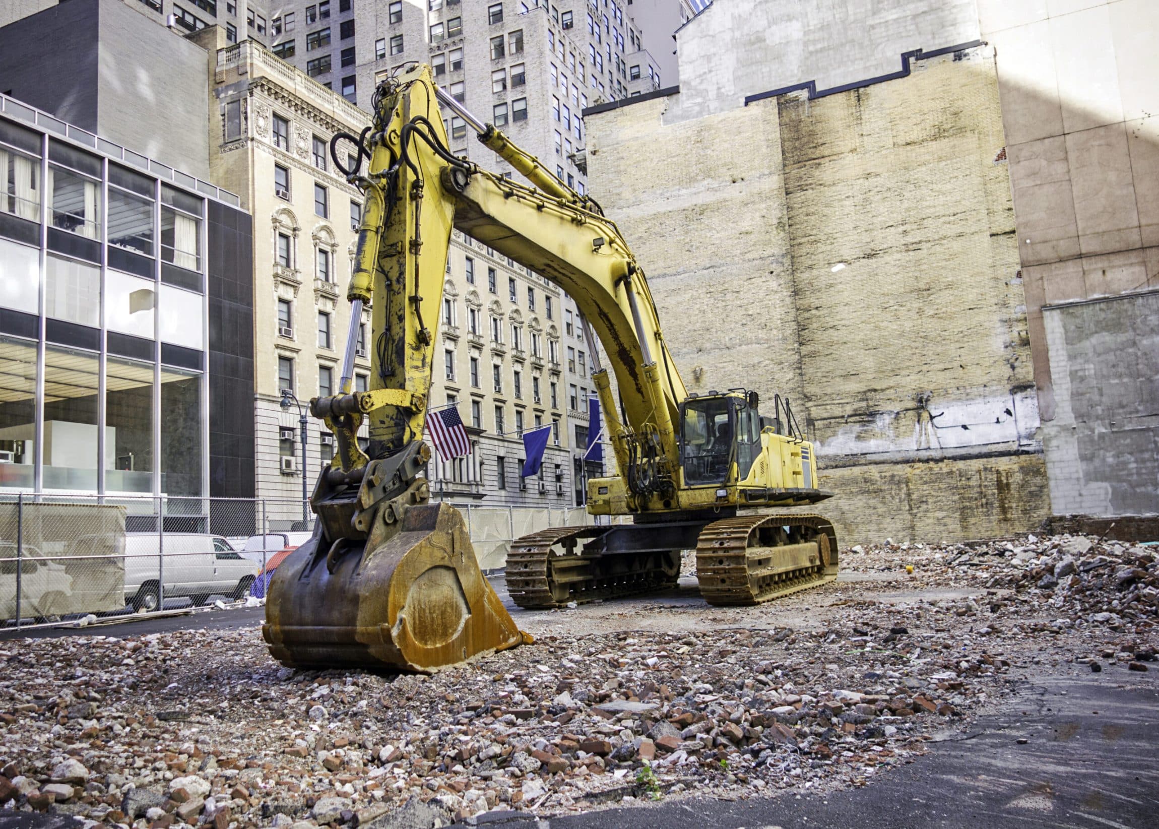 A backhoe working on vacant land