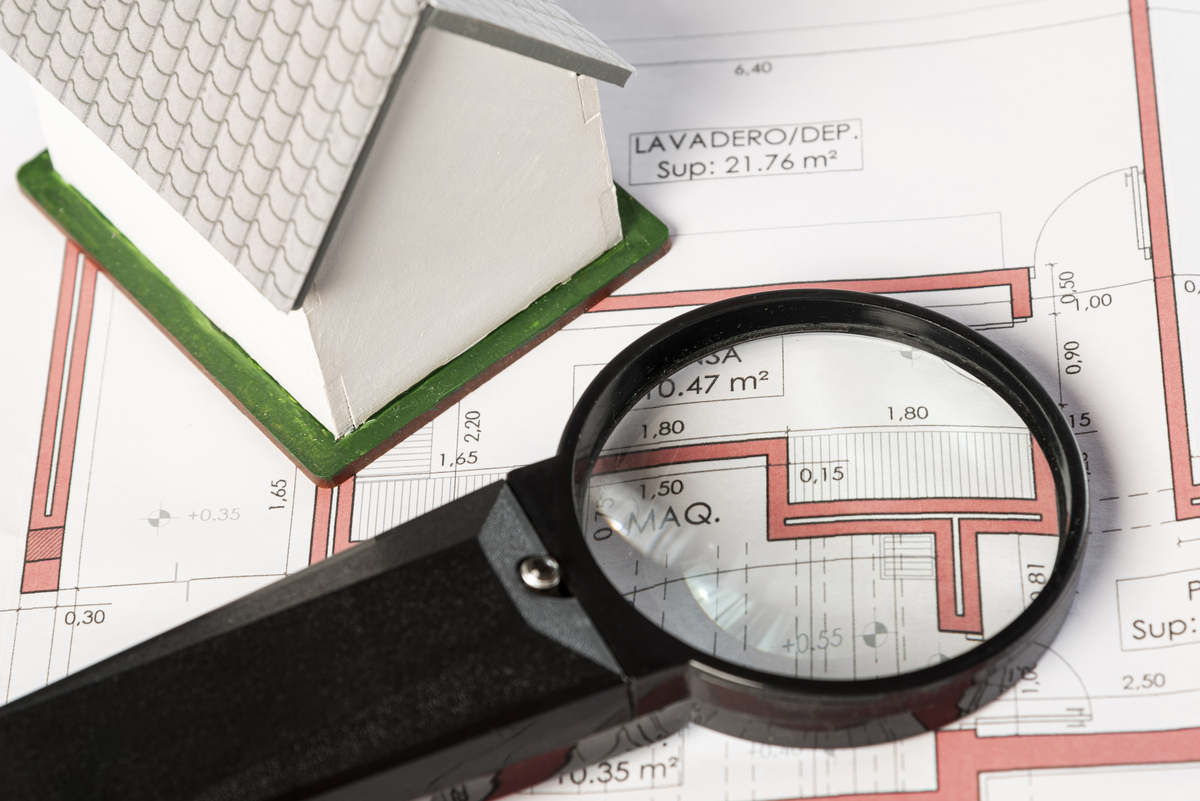A magnifying glass on a land appraisal document