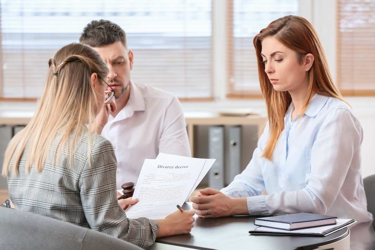 Couple signing a divorce decree.
