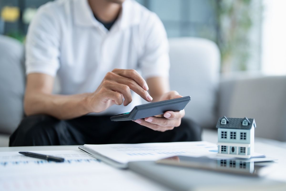 Man completing property tax payment paperwork