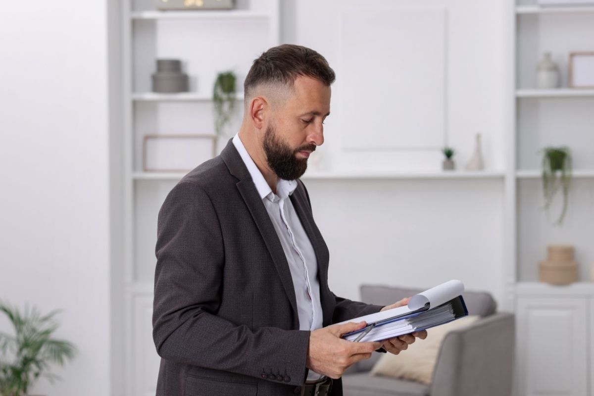 Real estate appraiser visiting residential house