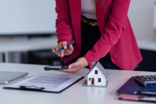 Woman conducting real estate property valuation