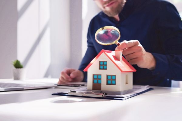 Appraiser conducting detailed property value analysis