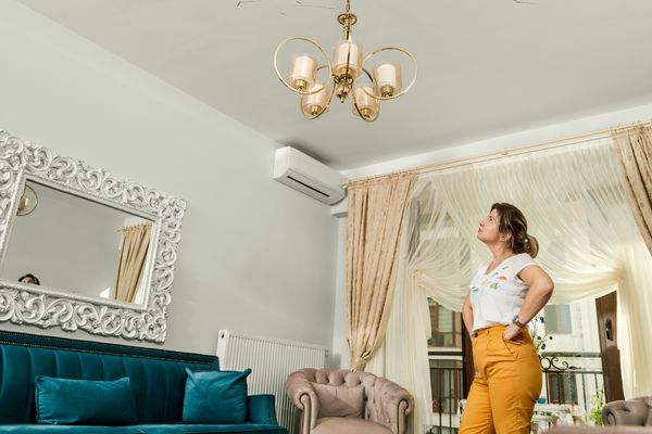 Woman inspecting house interior for issues