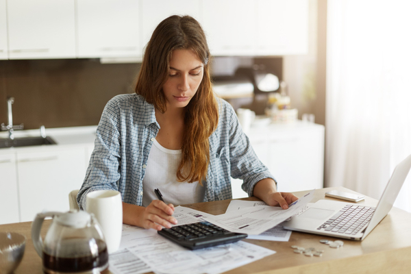 A woman budgeting for a home appraisal 