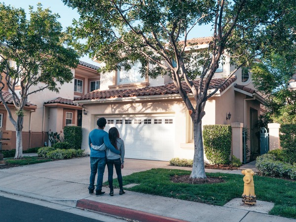 A woman talking to the homeowners