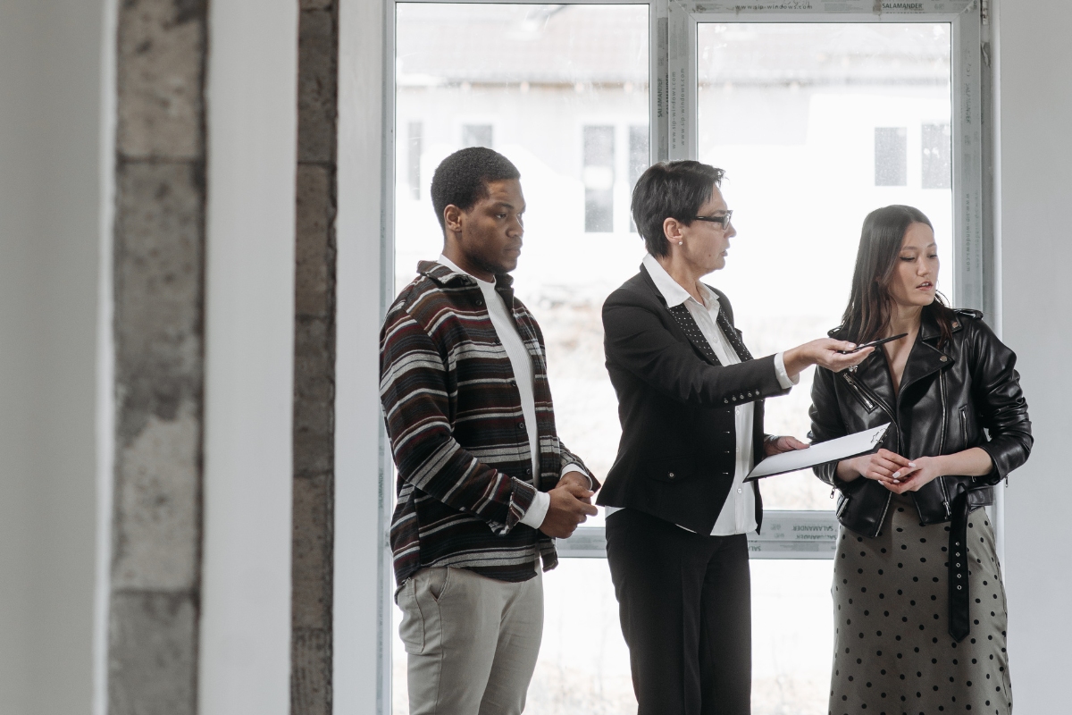 Property appraisal expert talking to her clients.