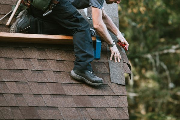 Certified contractor inspecting roof