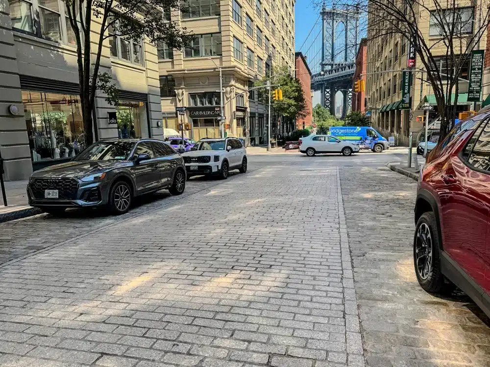 DUMBO street view with the Manhattan Bridge, representing Brooklyn’s waterfront neighborhood.