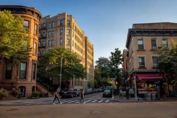 Brooklyn neighborhood street with mixed residential buildings